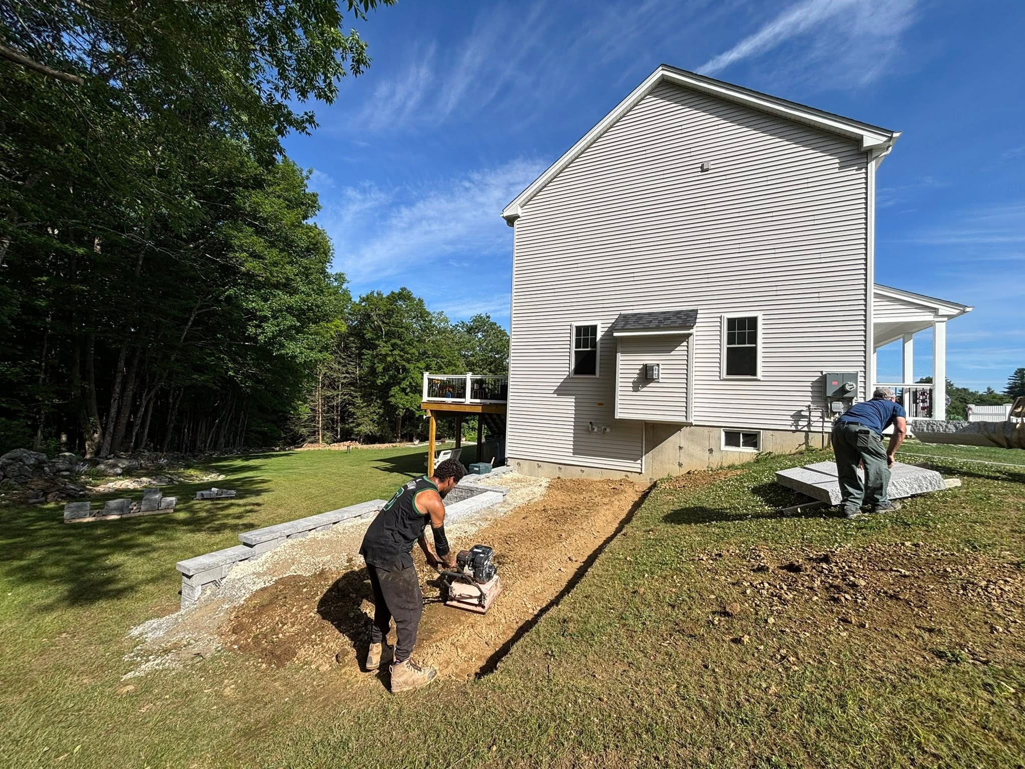 Retaining wall being built course by course